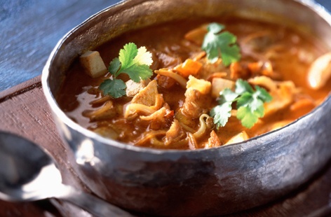 To make this speedy and fragrant Laksa, a spiced Malaysian coconut soup, first make a paste by blitzing shallots and aromatics, then it's just a question of adding stock and coconut milk to make a simmering broth for the chicken, beansprouts, and noodles.