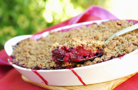 The quintessential crumble pudding, this autumnal favourite is made even sweeter with the addition of blackberries. When making the crumble topping, rub everything together quickly and lightly between fingertips to get that rough breadcrumb texture.