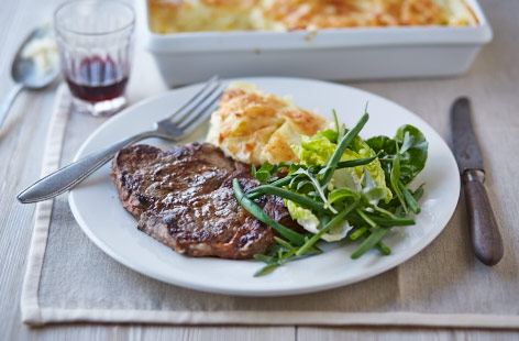 Succulent steaks, a garlicky sauce and golden tatties make for a winning combination in this delicious meal