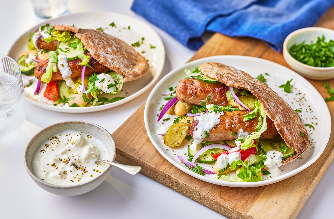 Greek-inspired sausage pittas recipe