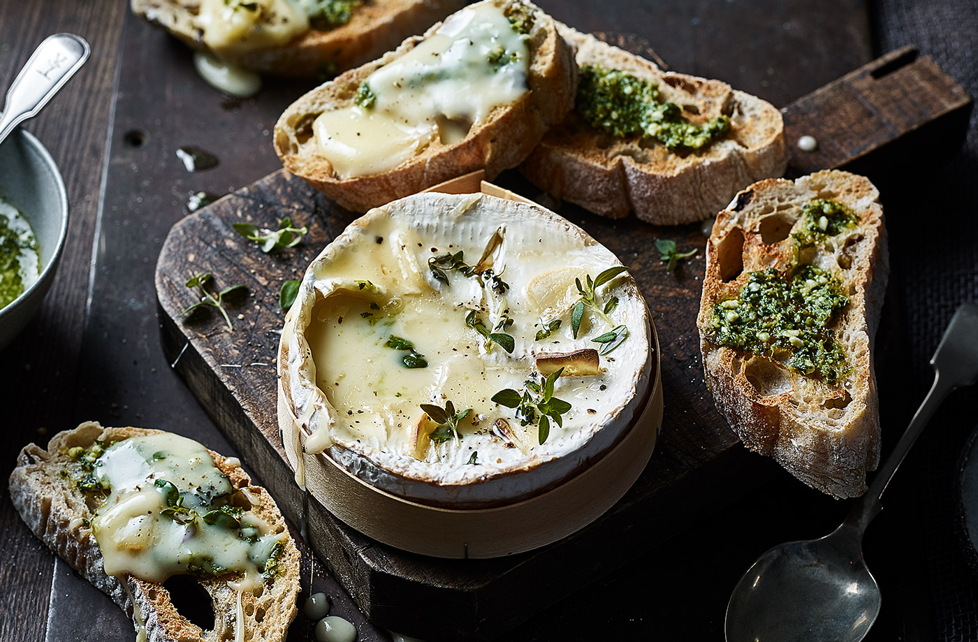 Baked smoked garlic cheese with pesto toasts recipe