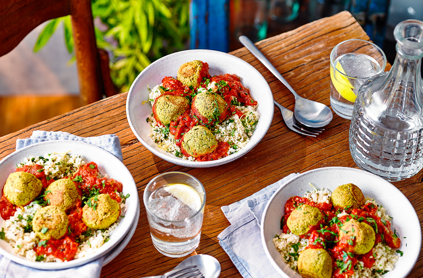 Tomato falafel traybake with lemony couscous recipe