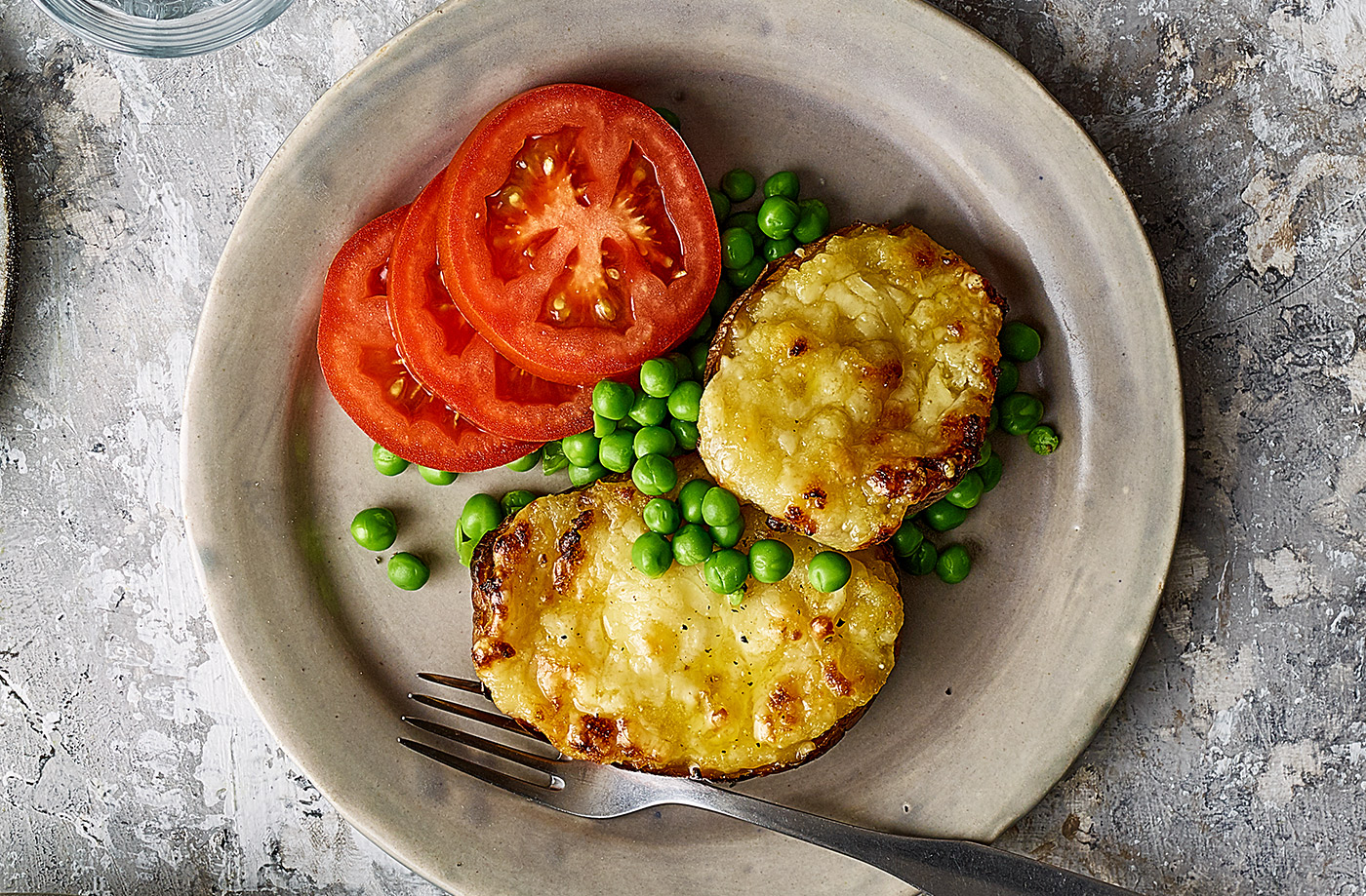 Cheesy stuffed potatoes with tomatoes and peas recipe