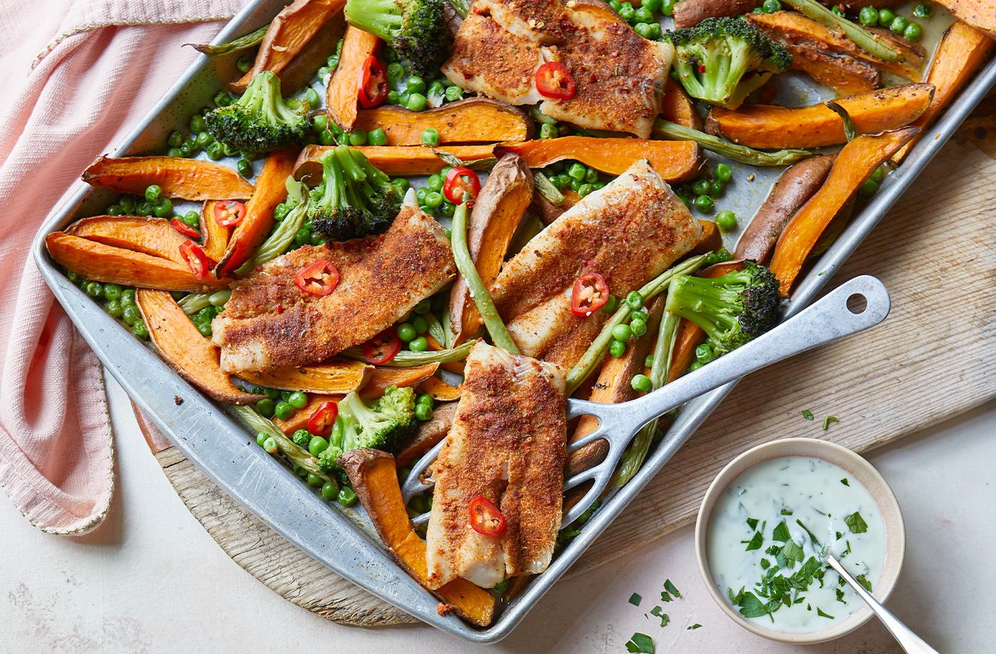 Piri-piri fish, sweet potato and broccoli traybake recipe