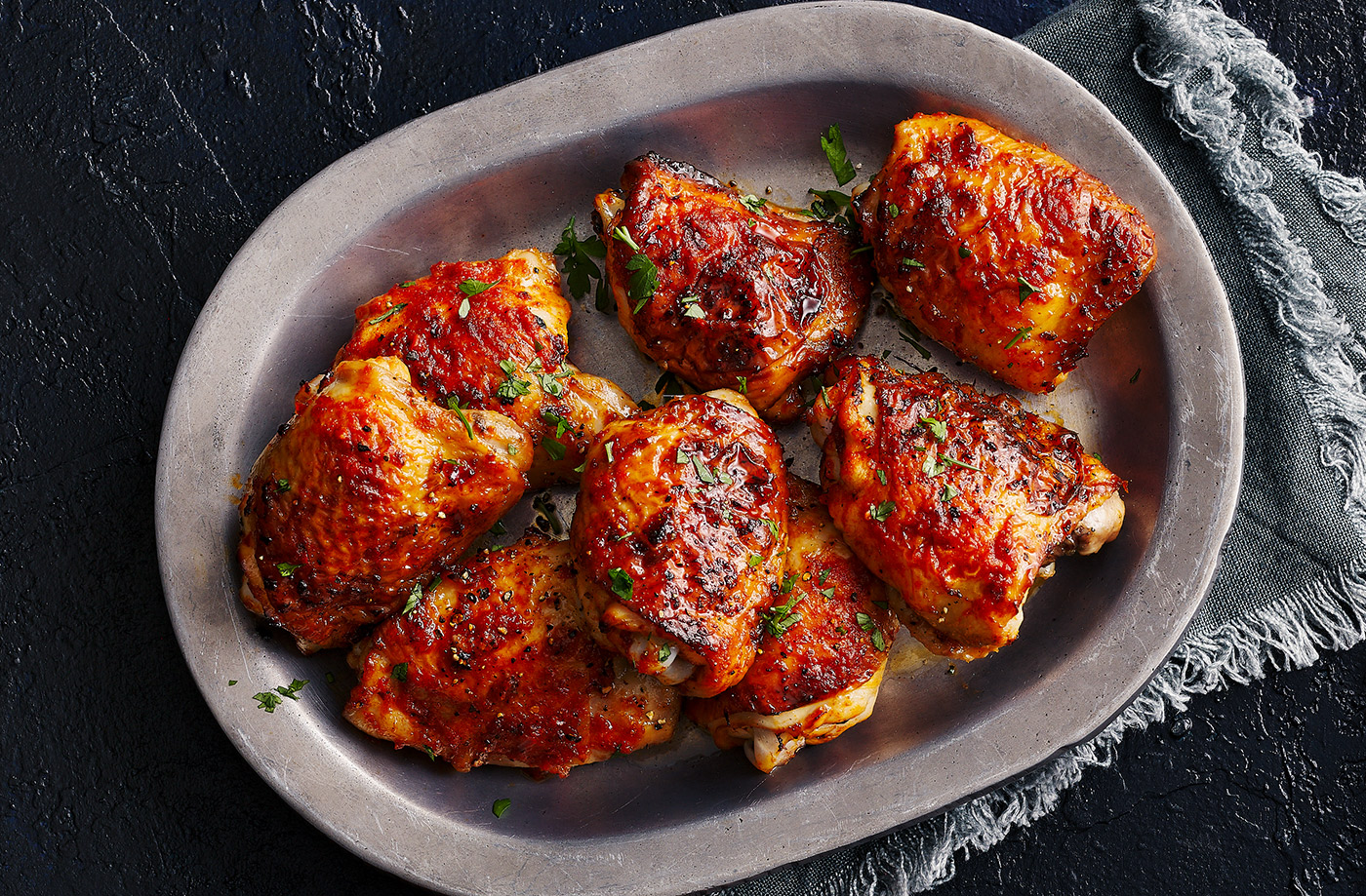 Sticky honey, garlic and harissa chicken thighs recipe