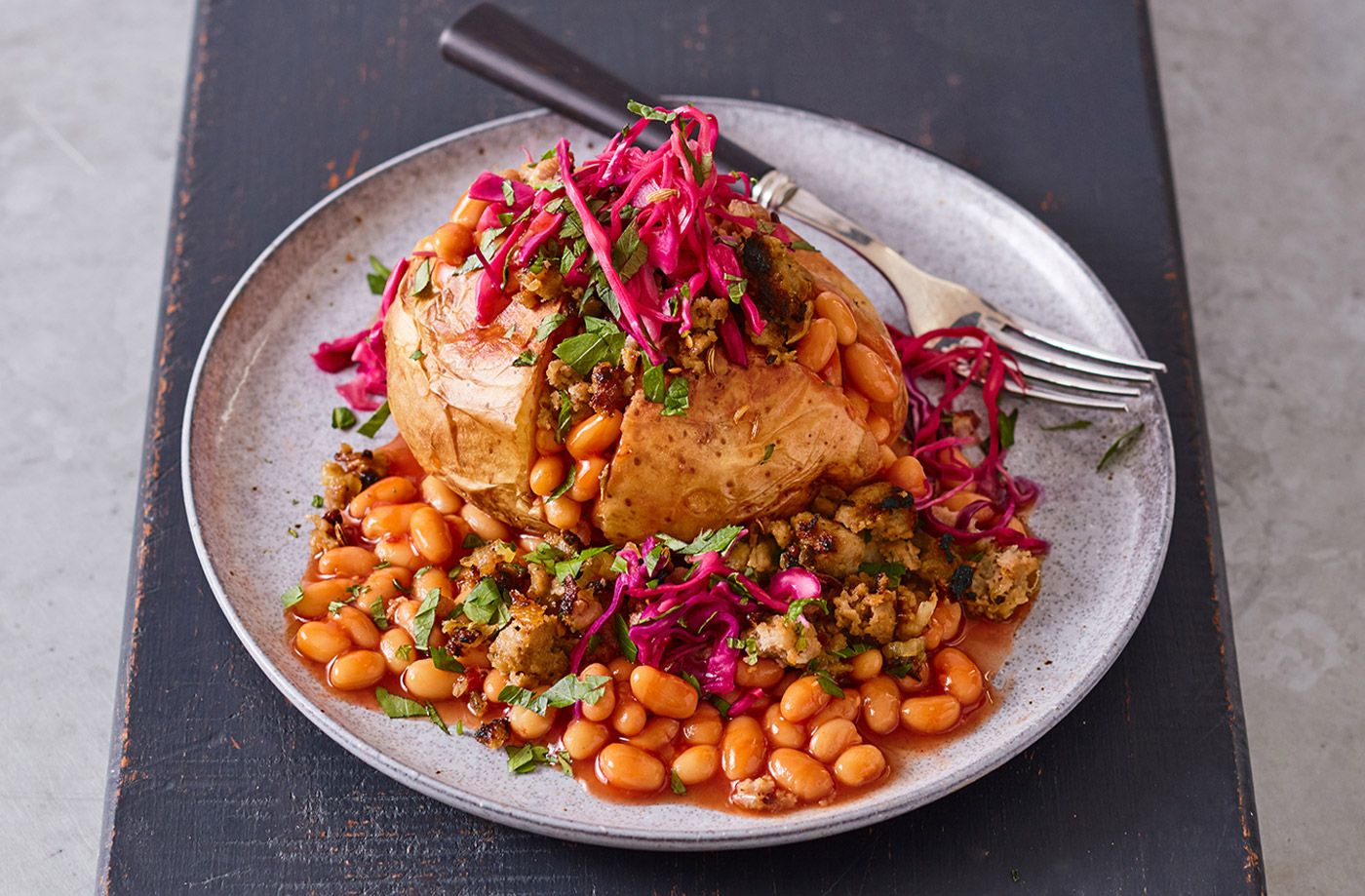 Jacket potatoes with fennel sausage and beans recipe