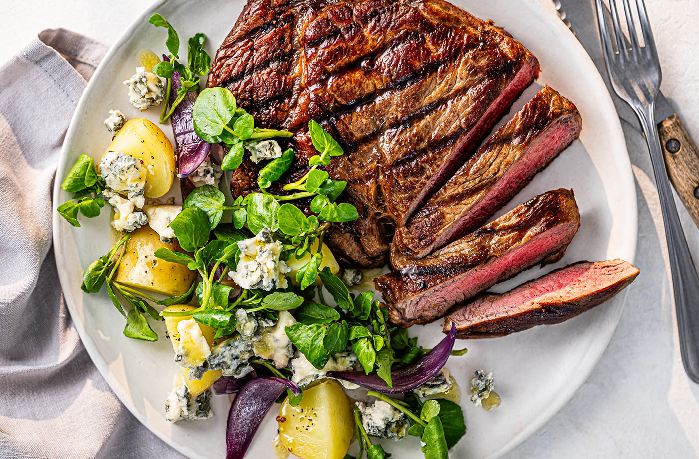 Ribeye steak with new potatoes, blue cheese and watercress recipe