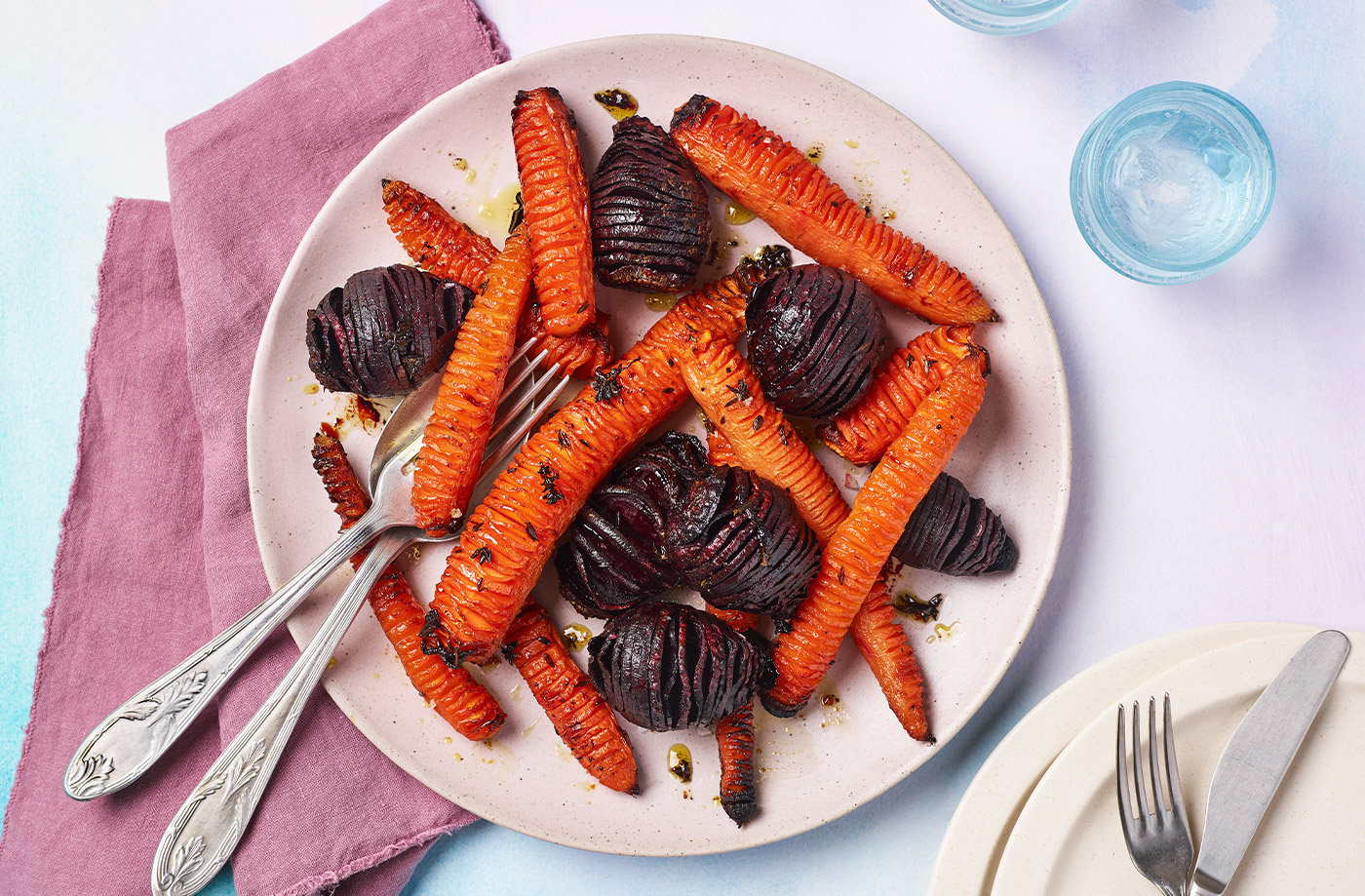 Sticky hasselback beetroot and carrots recipe