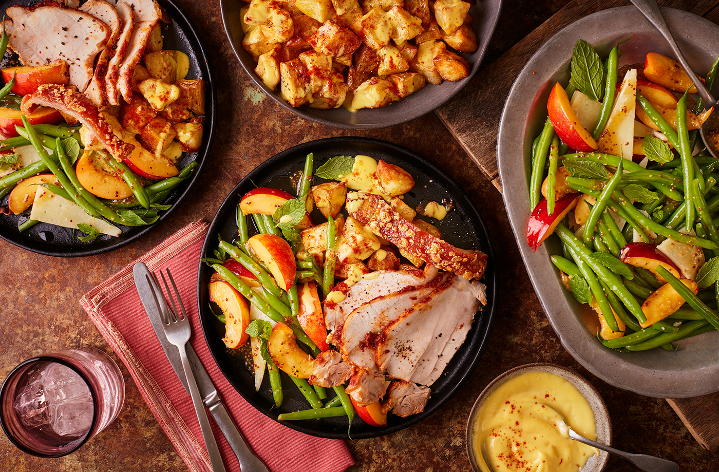 Paprika and garlic rubbed roast pork with roast potatoes, nectarine salad and saffron aioli recipe