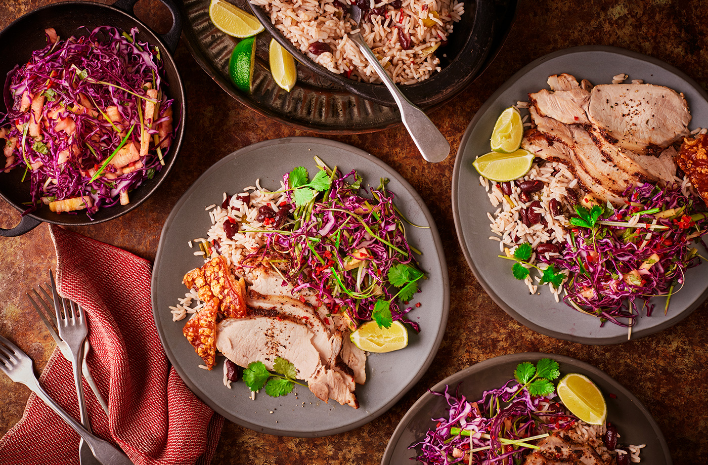Jerk-rubbed pork with rice and peas and pineapple slaw recipe