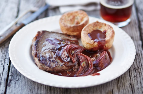 Turn simple steaks into an extra special meal and serve with wild mushroom Yorkshire puddings topped with a roasted red onion and red wine gravy
