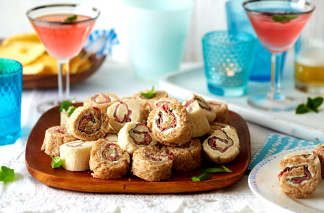 Get rolling with the kids with these tasty pinwheel sandwiches filled with cream cheese, beef pastrami and fresh basil