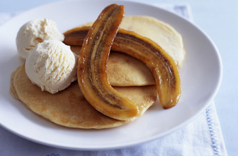 How does one improve upon a stack of fresh-out-the-pan pancakes? Well, one serves pancakes with caramelised bananas and a scoop of cooling vanilla ice cream, of course. And don't forget to flambé your bananas with as much panache as possible.
