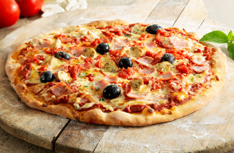 A simple pizza recipe with the classic combination of ham and cheese, jazzed up with plump mushrooms and black olives. Try it for your next night in with family or friends. Just add a crispy salad and you're good to go.