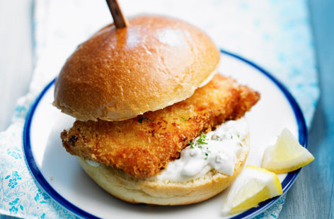 A great summer alternative to a beef burger, this crispy fried fish burger is light and yet indulgent and perfect served with chunks of lemon for squeezing.