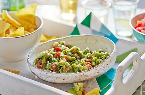 Grab a tortilla chip and dip into this gorgeous guacamole! Simply stir sharp lime and fragrant coriander through creamy, mashed avocado, alongside chopped tomatoes for extra bite, and you’re good to go. Add to a Mexican feast or enjoy as a quick snack