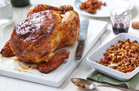 Add a spark to a classic roast chicken with a spicy stuffing of chorizo, fresh herbs and smoked paprika