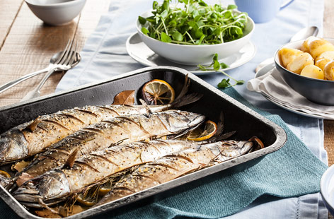 Enjoy this rich tasting fish at its simplest, with lemon slices and lovely herbs