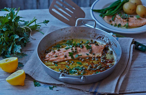 Impress your dinner guests with this pan-fried rainbow trout served with a lemony sauce, briny capers, and butter parsley