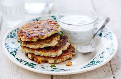 If you're after a summer snack that won't leave you feeling heavy or bloated, these gluten-free corn fritters should do the trick. Served alongside a tart yogurt, honey and mint dip, they're ideal for eating while soaking up some sun rays.
