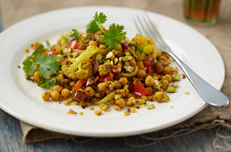 This Moroccan-inspired mixed grain pilaf makes a delicious, complete meal with a tasty combination of cauliflower, chickpeas, vegetables, dates and nuts