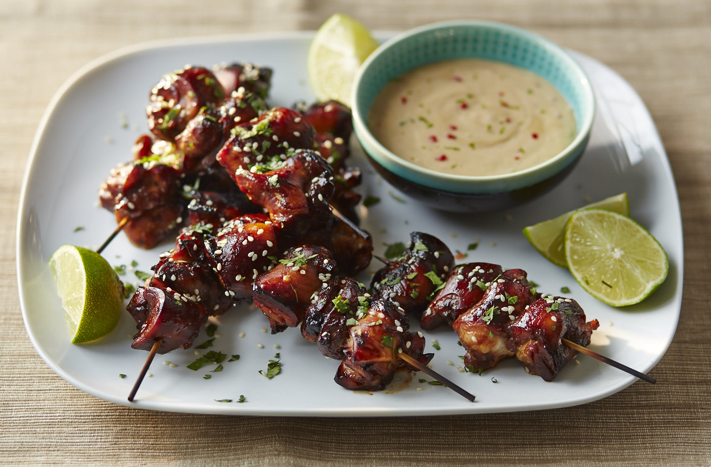 Sticky teriyaki chicken bites with peanut dip recipe
