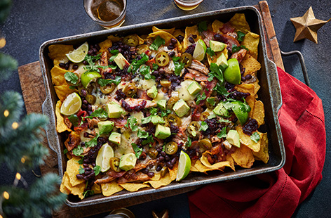 Got a fridge full of leftovers? Our cheeseboard nachos are here to save the day! Use whatever leftover cheeses you have and layer on top of nachos with cranberry sauce, turkey and bacon – whatever's going.