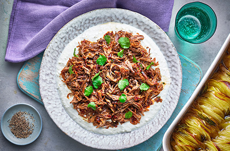 Sticky, sweet and spicy, this hot honey lamb is the ultimate Easter centrepiece. Slow cook your lamb shoulder for 6 hours until the meat is soft and tender. Shred the lamb onto whipped feta with a scattering of fresh coriander. This is a dish that's sure to impress!