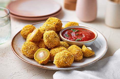 These crispy stuffed olives are seriously worth the hype. Make a garlic and cheese sauce to fill your olives, then coat in golden breadcumbs. We like to use an air-fryer to cook these to get them extra crispy.