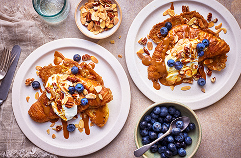These luxe croissants are coated in a spiced eggy mix and pan fried until golden. Stack with a glossy caramel sauce, nuts and a dollop of yogurt for a speedy breakfast that makes a great alternative to French toast.