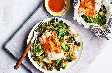 Frozen hake fillets pair well with fresh pak choi and an edamame and vegetable stir fry mix under a fiery soy, chilli and ginger dressing in this simple recipe