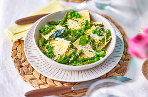 Impress guests with this clever cheat's primavera ravioli recipe using fresh lasagne sheets to make delicious ricotta and spinach parcels
