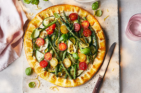 Bursting with the smoky goodness of barbecued vegetables, this galette is wrapped in a buttery shortcrust pastry crust and topped with tangy soft cheese. Baked to golden perfection, it's a dish that combines simplicity and vibrant flavours.