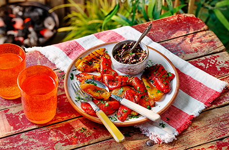 Slather sweet griddled peppers in a tangy olive dressing in this easy BBQ side recipe. The simple dressing combines kalamata olives, zesty lemons, garlic and plenty of fresh parsley.