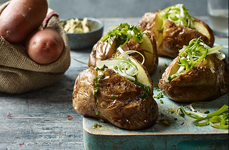 Filled with a hot and zesty chipotle-lime butter, these baked potatoes make for a great lunch or dinner
