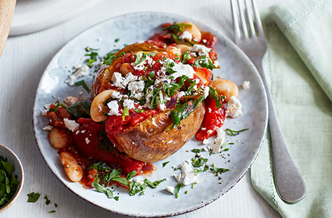 Filling and full of flavour, this recipe for baked potatoes with tomato butter beans is a simple and satisfying
