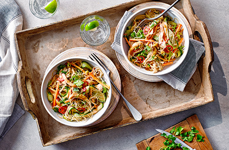 Got leftover chicken from a Sunday roast? Turn it into this quick bang bang chicken recipe - toss the chicken in a spicy ginger and peanut dressing along with plenty of fresh raw veg, chilli and rice noodles for an easy Chinese-inspired salad.