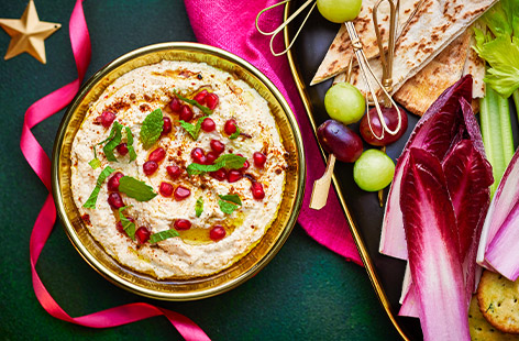 Add some Middle Eastern-inspired finishing touches to readymade houmous and you have an attractive and delicious dip that will hold it own amongst homemade! Stir spices and olive oil through houmous, top with pomegranate seeds, oil and mint and serve at your festive gatherings – and beyond!