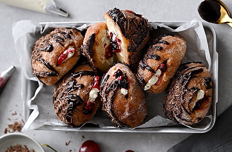 For your next indulgent treat, why not try these cherry jam filled Black Forest inspired doughnuts?
