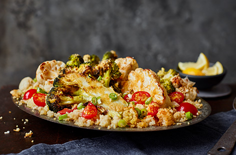 Try this Middle Eastern-inspired roasted broccoli and cauliflower couscous for your next vegetarian dinner. The veg is sliced into thick steaks and brushed with garlic and lemon houmous to caramelise whilst roasting on top of fluffy couscous.