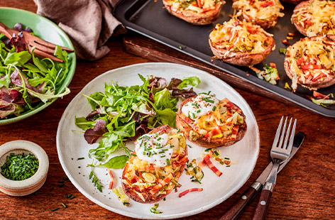 These loaded skins are filled with fluffy potato, mixed with finely shredded leeks and sprouts, vegan cheese and meat-free smoky rashers. Serve with a green salad for a hearty midweek meal.