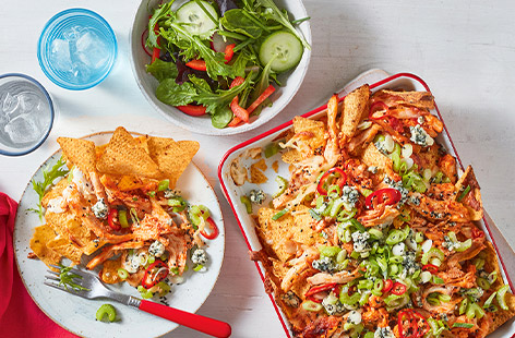 Turn leftover roast chicken into tasty nachos! This recipe works well with a variety of hot sauces, we suggest using a milder version so you can use a good amount of it to coat the chicken. Dig in!