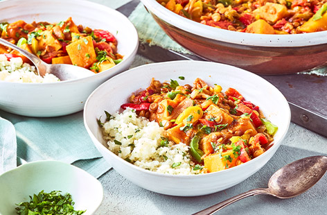 With butternut squash, peppers and lentils, this vegan tagine is packed full with vibrant veggies. Serve with cauliflower 'couscous' and a sprinkling of fresh coriander.