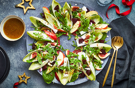 Brighten up your Christmas table with a centrepiece salad that pairs peppery rocket, seasonal chicory and sweet apple.