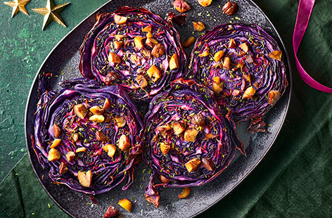 These vibrant red cabbage 'steaks' are roasted until tender and crispy and are topped with chestnuts for extra festive flavours. They'll make a deliciously different side for your Christmas dinner!