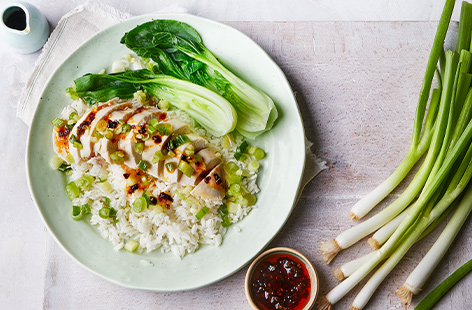 Poached until tender, this Cantonese-style chicken breast is topped with a zingy, punchy ginger and spring onion dressing