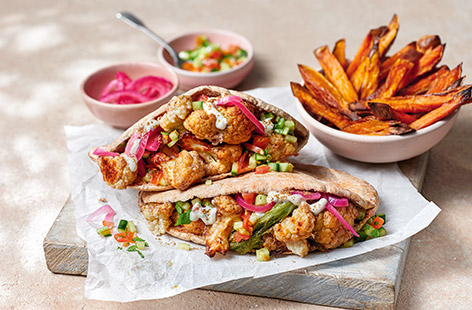 This healthier version of a shawarma is filled with crispy spiced cauliflower and a zingy salsa for a colourful veg-packed dinner. Add coriander and soya yogurt for freshness and serve with sweet potato fries, if you like.