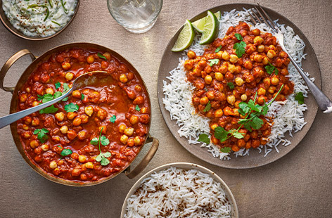 Transform tinned chickpeas into a delicious, hearty vegan curry. Serve with rice and a dollop of cooling yogurt-alternative for a fragrant, plant-based midweek meal.