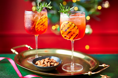 We've given Aperol spritz a festive spin with cranberry juice and rosemary. Make this in a jug ahead of time, then pour when your guests arrive -  the perfect Christmas party cocktail. 