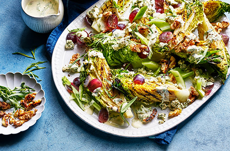 Charred lettuce transforms a retro salad into a special lunch or side dish. Topped with a tangy yogurt dressing and crumbled blue cheese, this quick and easy recipe is summer on a plate.